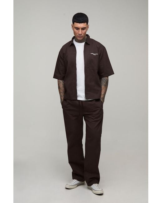 BoohooMAN Black Tall Oversized Pocket Embroidered Twill Zip Up Shirt & Relaxed Trouser Set for men