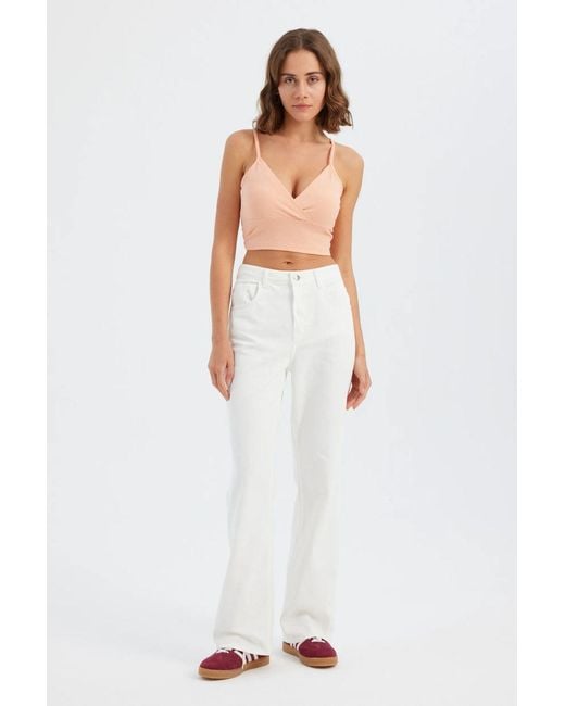 Hiccup White Sleeveless V-Neck Basic Top