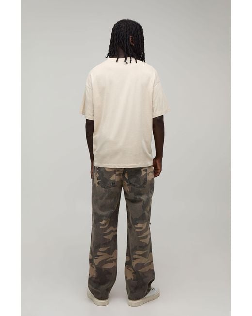 BoohooMAN Green Camo Gothic Cross Distressed Relaxed Fit Jeans for men