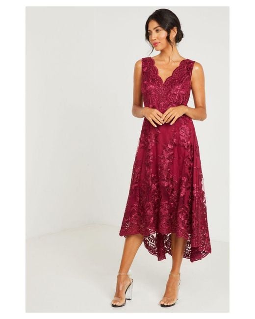 Navy embroidered bardot dip hem dress top