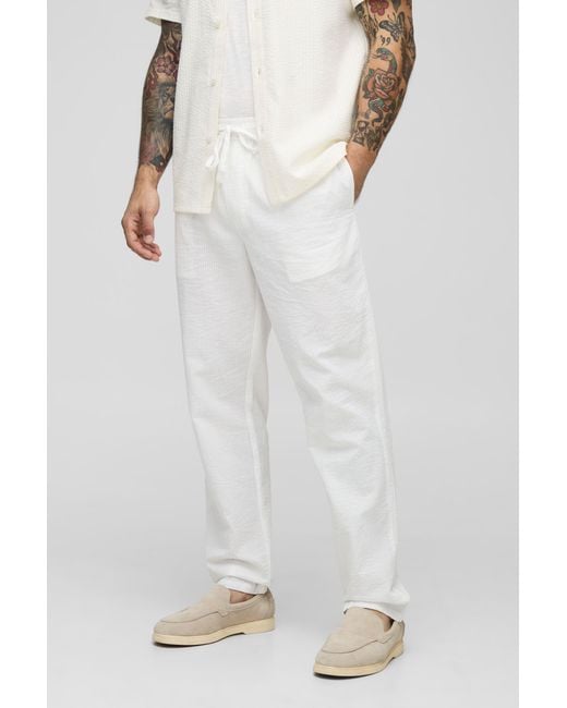 BoohooMAN White Elasticated Tapered Fit Striped Seersucker Pants for men