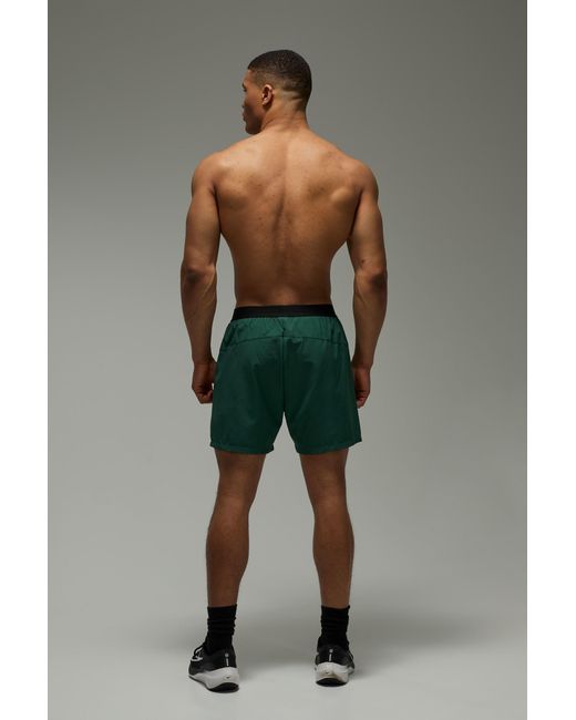 BoohooMAN Green Active Perforated Stretch Woven Regular Fit 5Inch Short for men