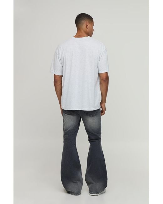 BoohooMAN Blue Crease Wash Ripped Knee Flared Jeans for men