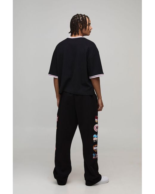 BoohooMAN Black Baggy Fit Varsity Badge Print Joggers for men