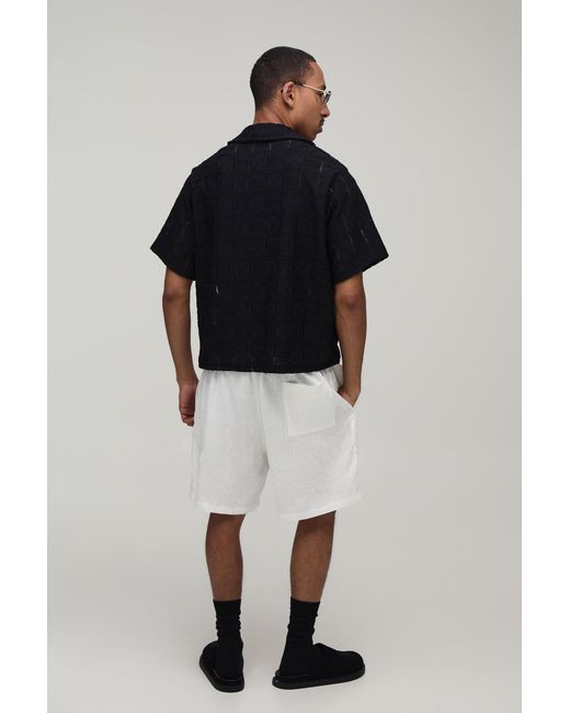 BoohooMAN Black Oversized Boxy Woven Floral V Neck Polo for men