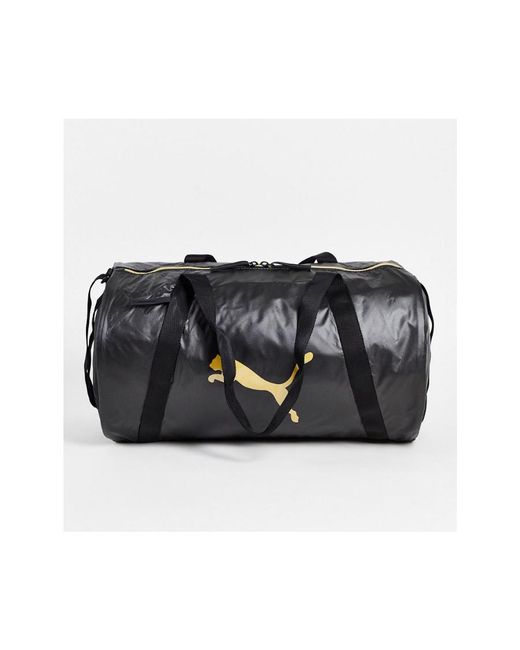 PUMA Training Essentials Barrel Bag In Black And Rose Gold