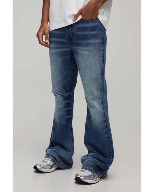 BoohooMAN Blue Crease Wash Ripped Knee Flared Jeans for men