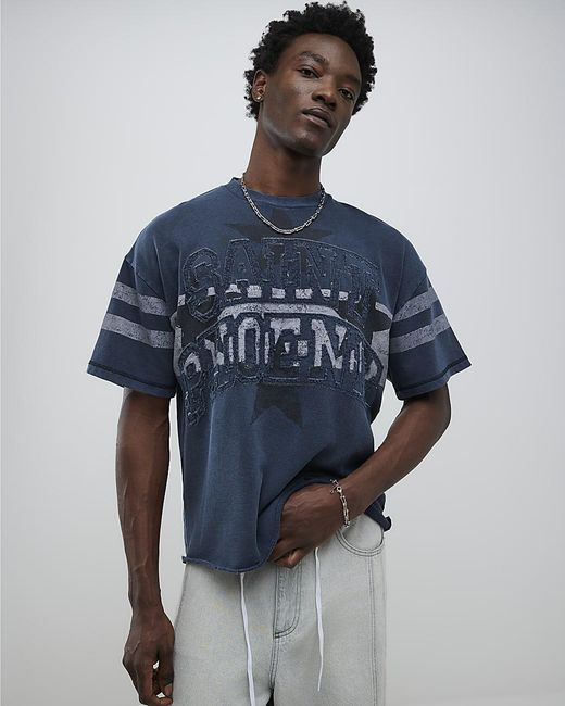 River Island - T-shirt avec imprimé soleil façon mosaïque - Bleu