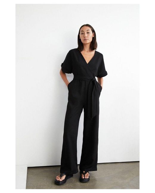 Warehouse Black Wrap Front Tie Waist Relaxed Jumpsuit
