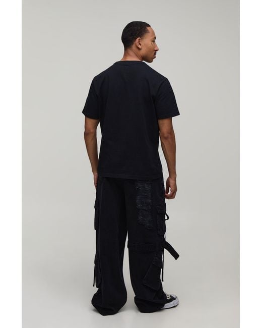 BoohooMAN Black Extreme Washed Cargo Strap Detail Baggy Jeans for men