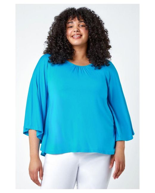 Roman Curve Blue Stretch Jersey Cape Sleeve Top