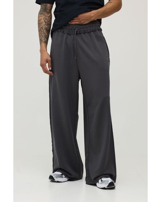 BoohooMAN Black Extreme Wide Leg Loopback Script Embroidered Raw Hem Joggers for men