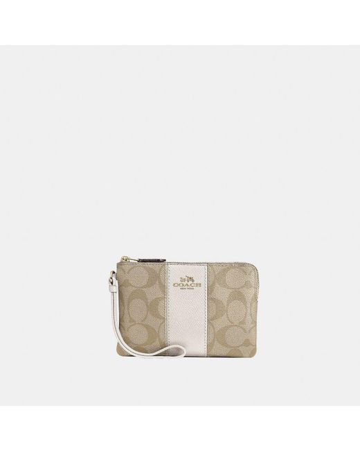 COACH White Signature Pvc With Leather Stripe Corner Zip Bag