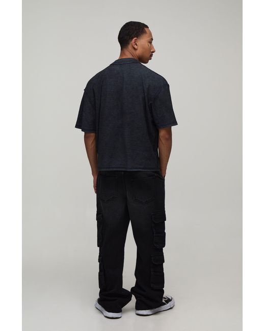 BoohooMAN Black Washed Relaxed Fit Cargo Flared Jeans for men
