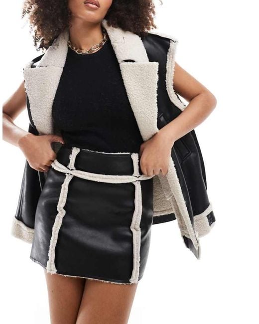 SNDY'S Black Leather Look Contrast Borg Detail Mini Skirt Co-Ord