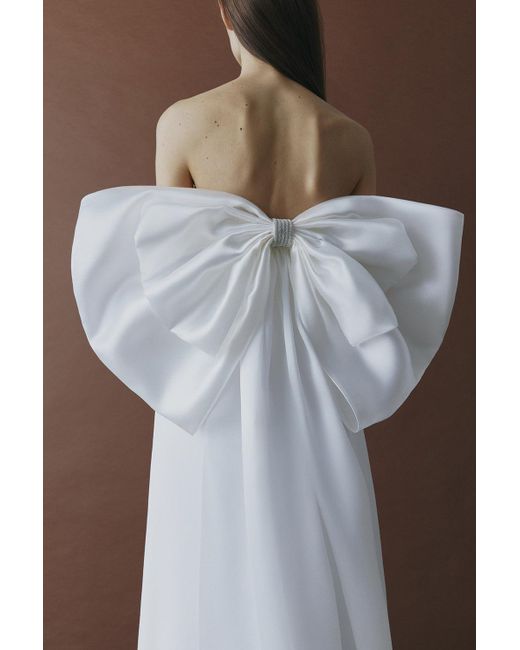 Total White White Dress With A Featuring Bow Accent On The Back