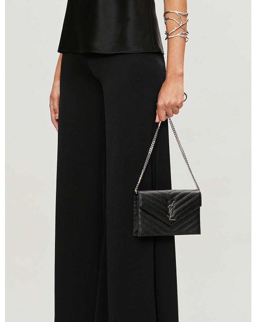 monogram leather clutch