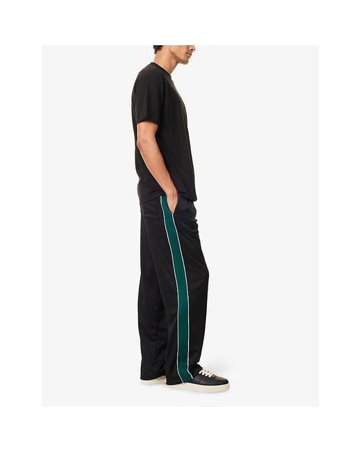 Cole Buxton Black Logo-Print Contrast-Stripe Woven Track Jogging Bottoms for men
