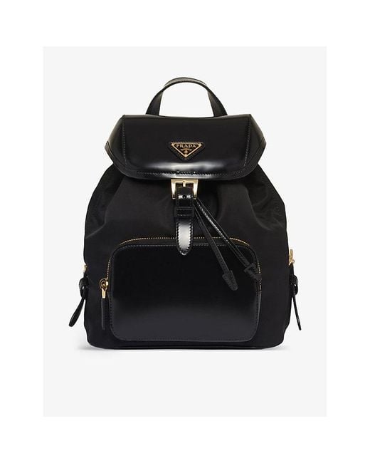 Prada Re-nylon Medium Brand-plaque Recycled-polyamide And Brushed Leather  Backpack in Black | Lyst