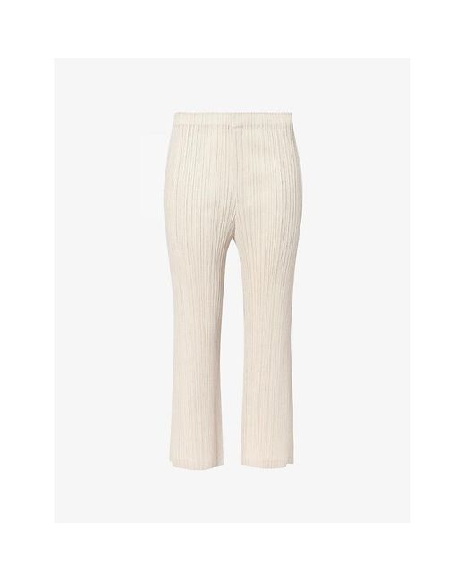 Pleats Please Issey Miyake Natural Pleated Mid-rise Flared-leg Knitted Trousers