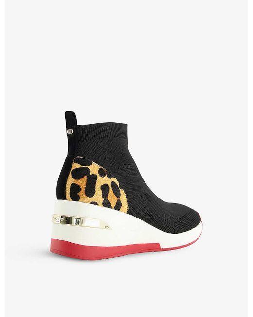 black wedge heel trainers