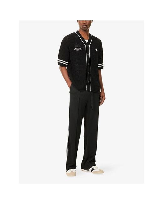 The Couture Club Black Tape Mesh Jogging Bottoms for men