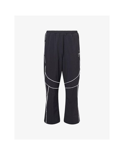 GYMSHARK Blue Retro Embroidered-Logo Stretch-Nylon Track Pants for men