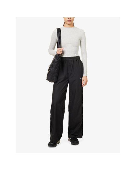 ADANOLA Black Logo-print Contrast-piping Relaxed-fit Shell Trouser