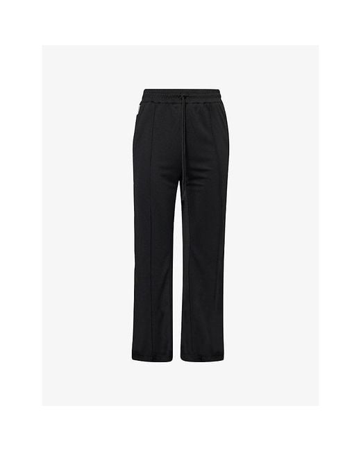 The Couture Club Black Tape Mesh Jogging Bottoms for men