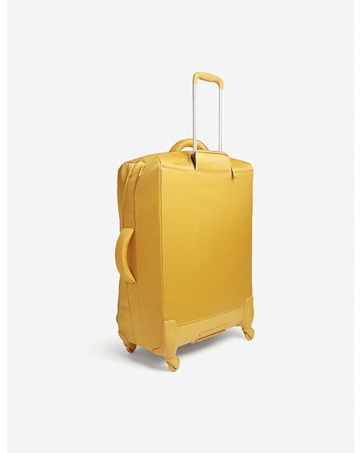 mustard yellow suitcase