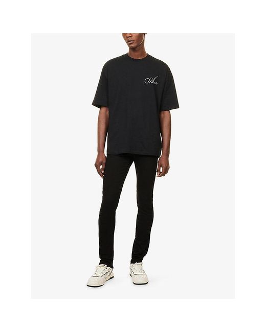 Amiri Black Stack Slim-Fit Stretch-Denim Jeans for men