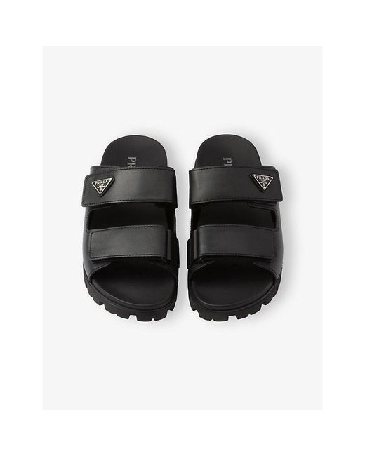 Prada Black Enamelled-Logo Leather Slides for men