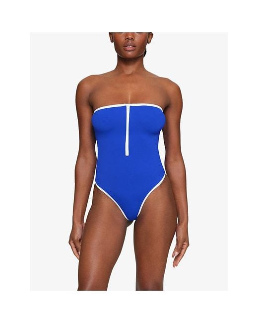 Skims Sporty Strapless Stretch-recycled Nylon Swimsuit Xxx in Blue