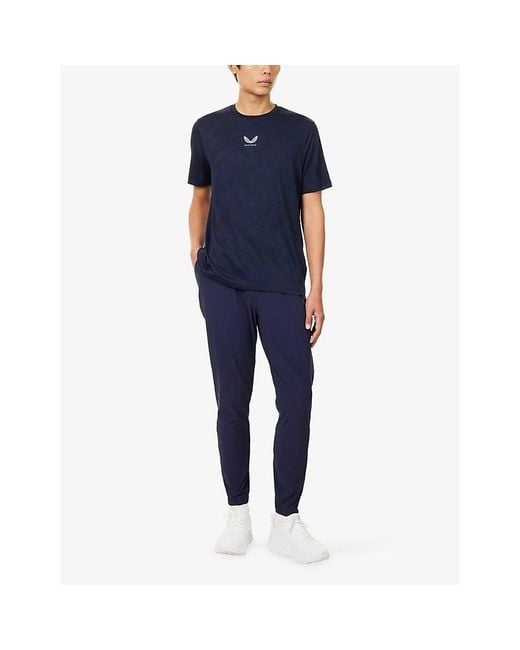 Castore Blue Pewter Flex Tech Logo-Print Stretch-Woven Trousers for men