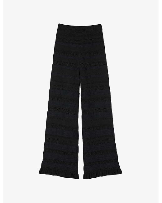 Sandro Black Ruffle-trim Flared-leg Stretch-knit Trousers