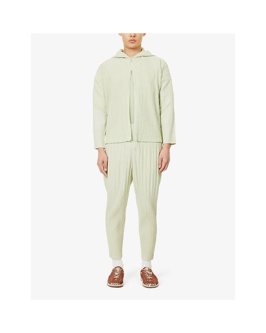 Homme Plissé Issey Miyake Natural Pleated Tapered-leg Relaxed-fit Knitted Trousers for men