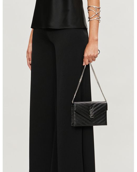 monogram quilted leather clutch