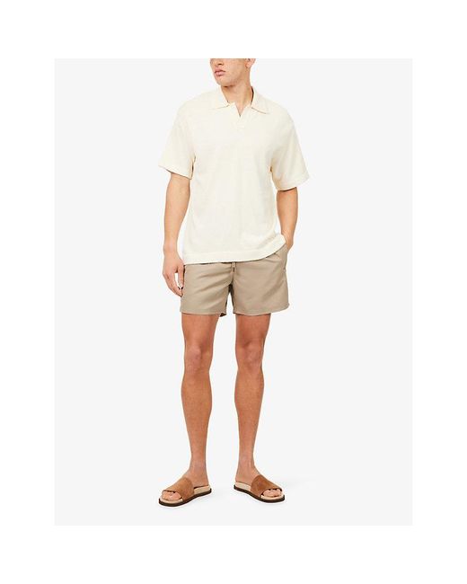 The Couture Club Natural Water Reactive Emblem Swim Shorts for men