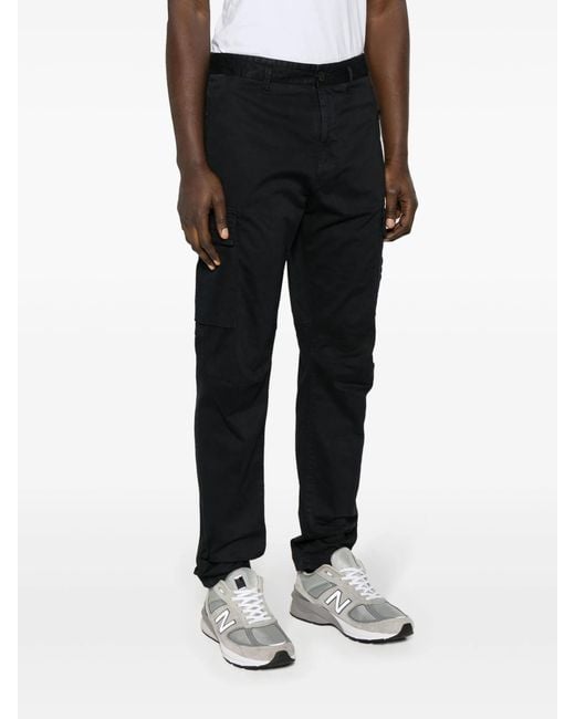 ¥ 40,270 Pantalone Regular tapered Stone Island Pantalone Regular Tapered in Black for Men | Lyst