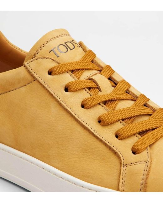Tod's Yellow Logo Stamped Lace Up Sneakers for men