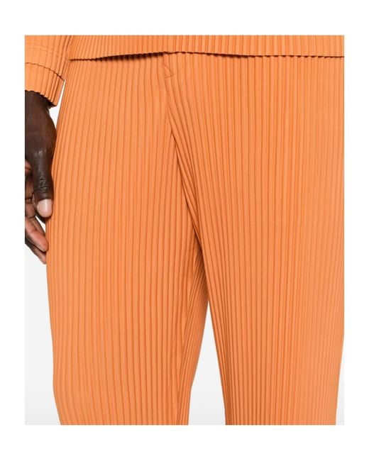 Homme Plissé Issey Miyake Orange March Pleated Trousers for men