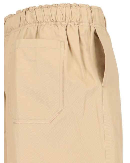 Prada Natural Triangle-Logo Plaque Wide-Leg Pants