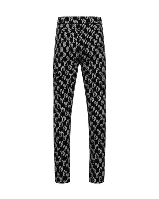 we11done Black Monogram Knitted Trousers
