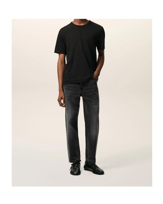 AMI Black Buttoned Cotton Jeans for men