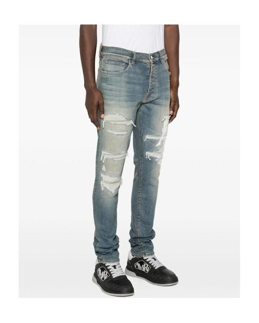 Amiri Blue Ripped Graphic Printed Jeans for men
