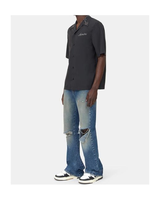 Amiri Blue Ripped-Knees Bootcut Denim Jeans for men