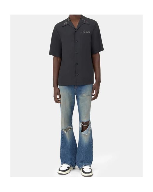Amiri Blue Ripped-Knees Bootcut Denim Jeans for men