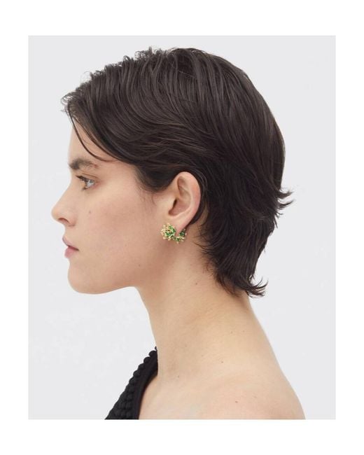Bottega Veneta Green Wearing Earrings On Top Of The Logo