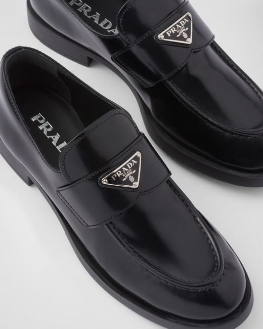 Prada Black Logo Plaque Almond-Toe Loafers