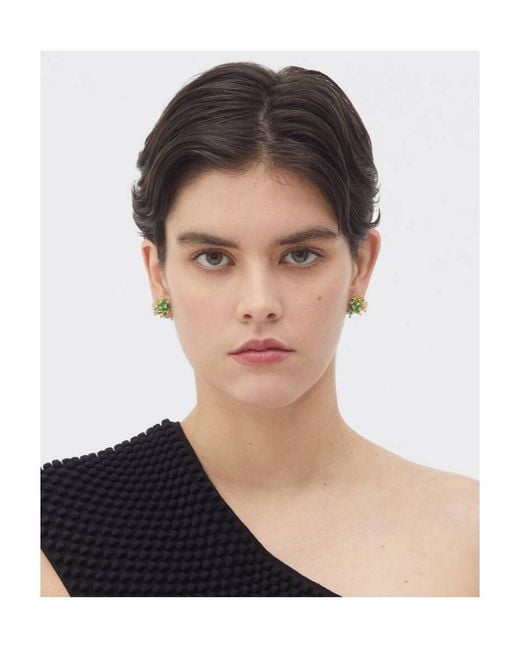Bottega Veneta Green Wearing Earrings On Top Of The Logo